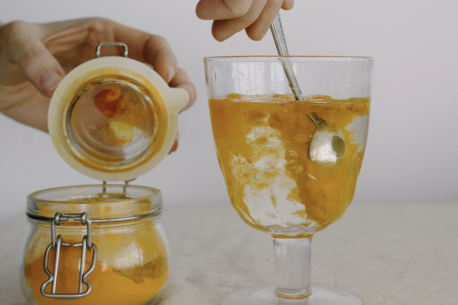 turmeric powder in a glass of water